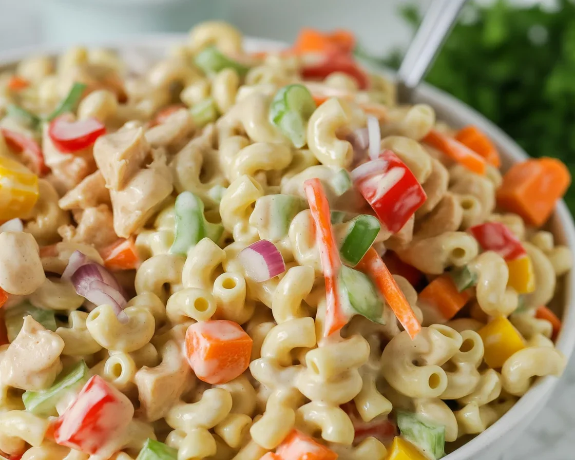 Healthy macaroni salad with fresh veggies, hard-boiled eggs, and a light dressing.