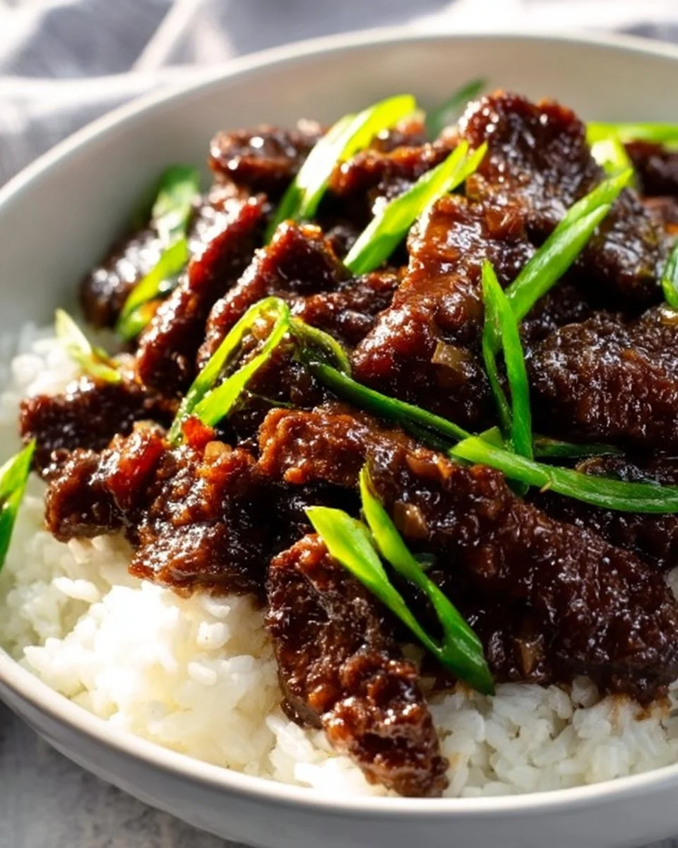 Delicious gluten-free Mongolian Beef served with vegetables and rice
