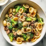 Orecchiette with sausage and broccoli served in a bowl