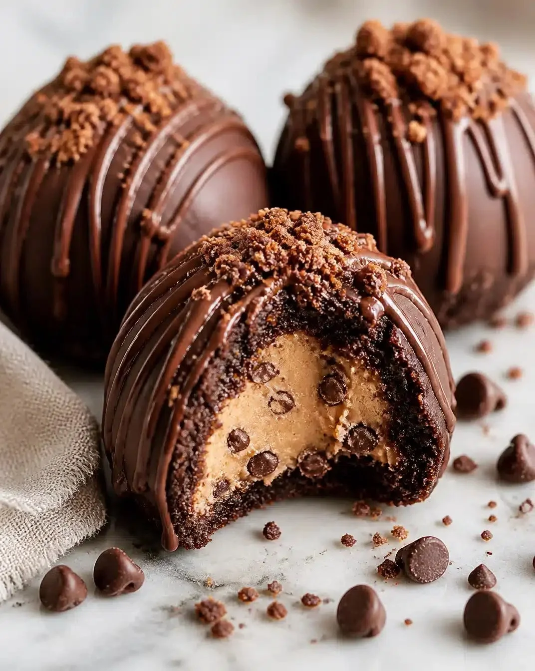 Cookie dough-stuffed brownie bombs ready to enjoy, a delicious dessert treat.