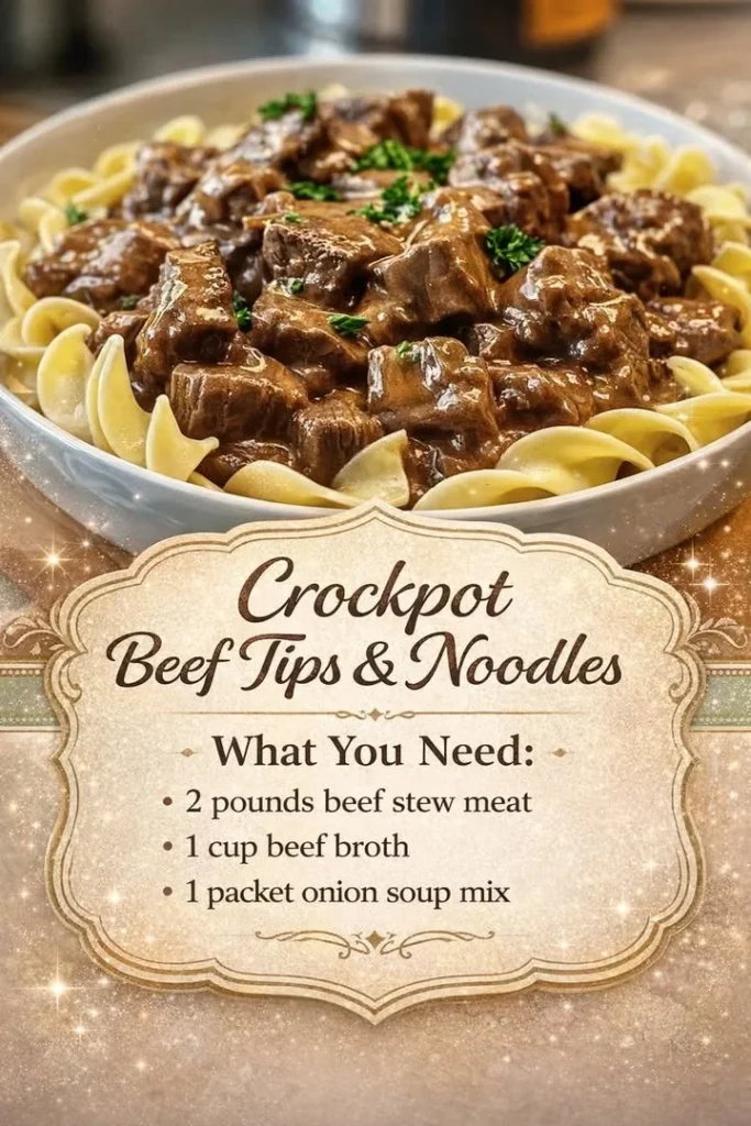 Crockpot beef tips served over noodles, garnished with herbs.