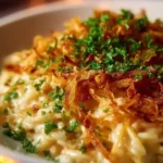 French Onion Chicken and Orzo Casserole topped with crispy onions