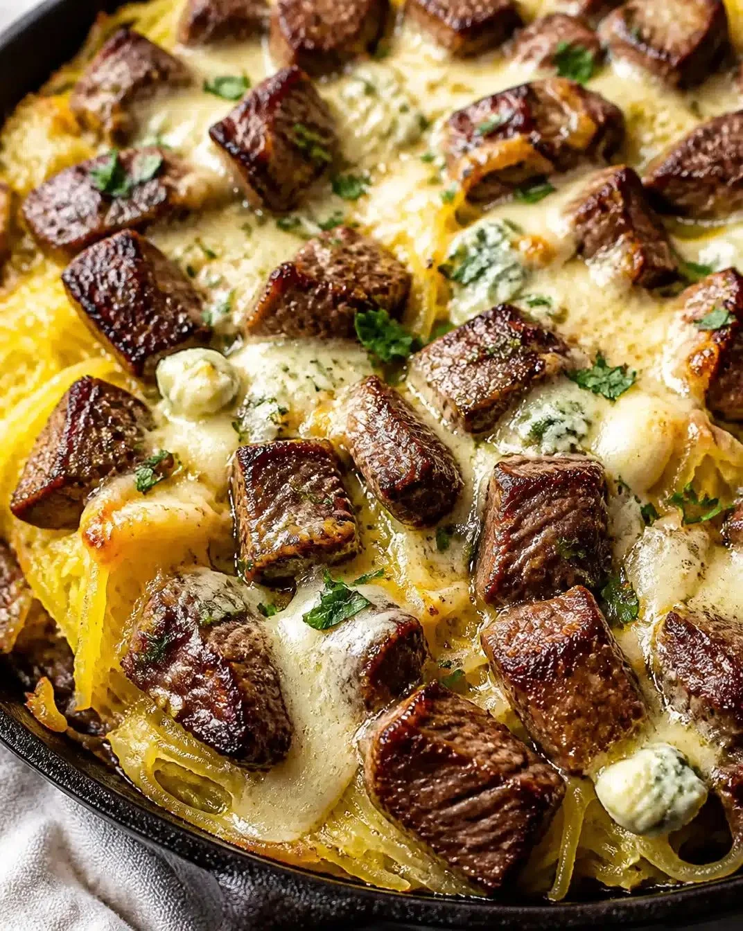 Keto Steak served with Gorgonzola Alfredo Squash on a plate