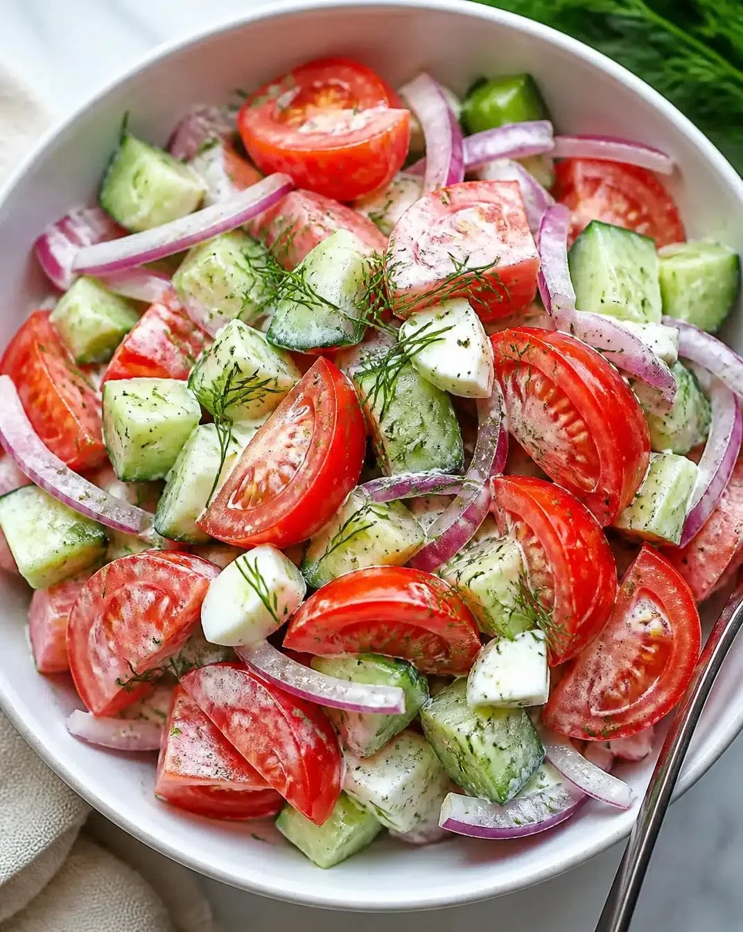 Fresh simple tomato salad with vibrant ingredients and dressing